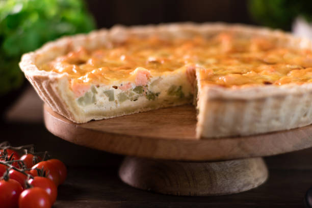 istock Delicious fresh quiche with broccoli, salmon and cheese 1352941949