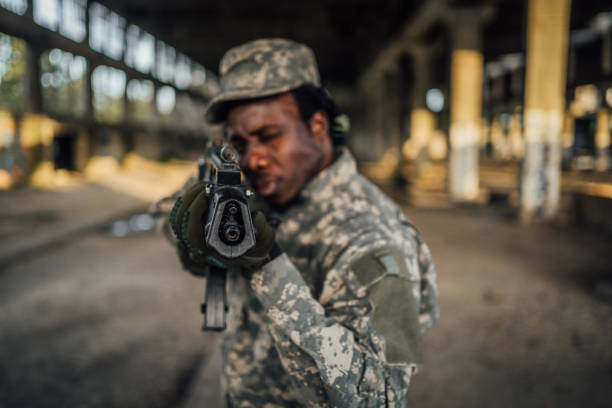 Portrait of armed soldier on mission in abandoned building