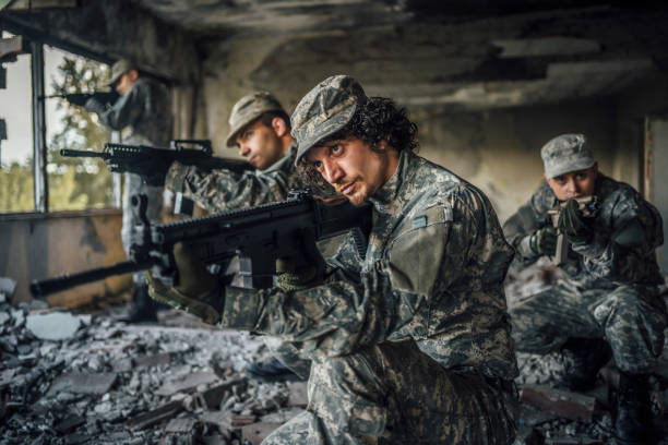 istock Soldiers with rifles 1352944463