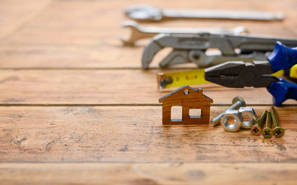 istock Wooden house and construction tools. House construction concept. 1352945388