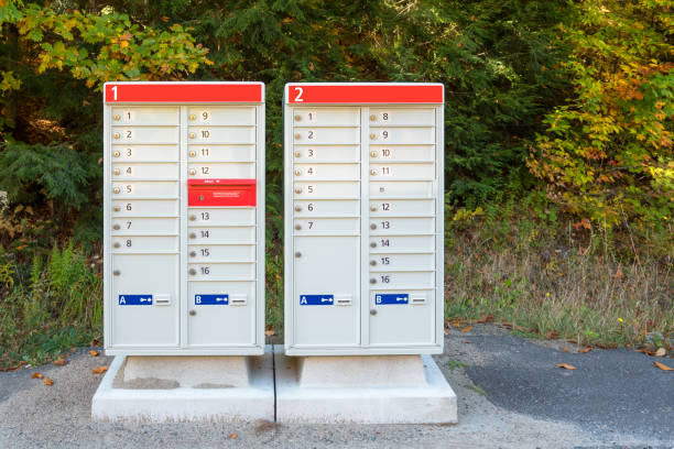 istock Community mailboxes along a road in the countryside 1352947349