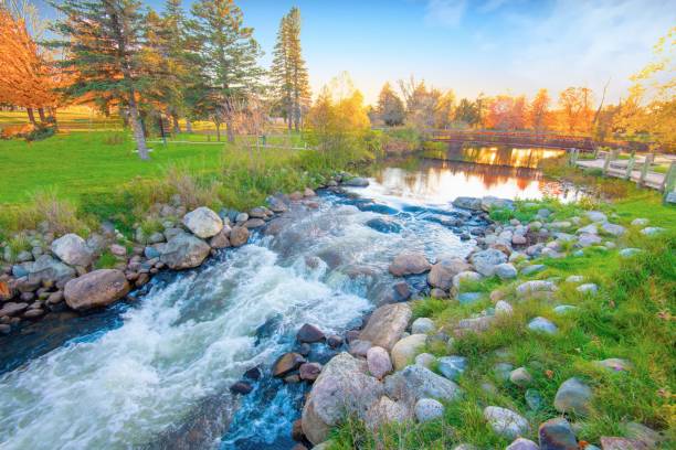 istock Waterfall on the AuSable River in fall-Grayling Michigan 1352950395