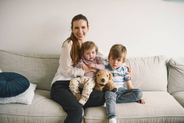 istock Mother with two children 1352952206