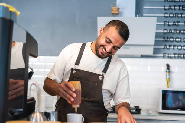istock Coffee Shop Owner Man Preparing Coffee 1352952296