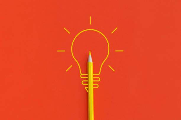 istock Light bulb on red background. Inspiration and creative idea concept. Top view with copy space. Flat lay composition. 1352952817