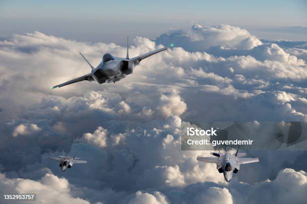 F35 Fighter Jets Flying Over Clouds Stock Photo - Download Image Now - Fighter Plane, Above, Stealth