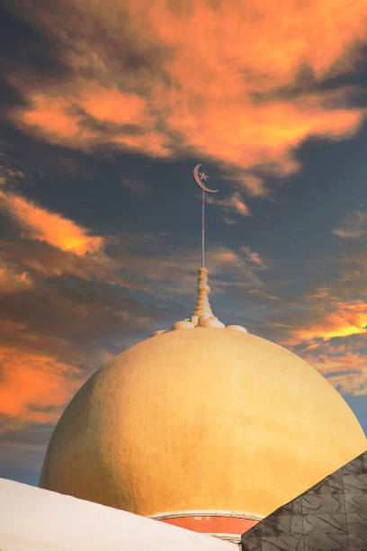 istock Crescent moon with stars Muslim mosque dome in blue sky background , ideal use as background 1352956346