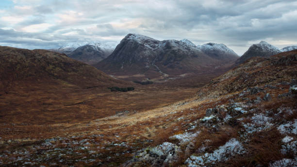 istock Winter Scottish landscape with mountains and valley 1352957383