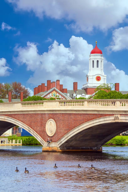 istock Vintage Bridge with clock tower over Charles River Boston 1352959513