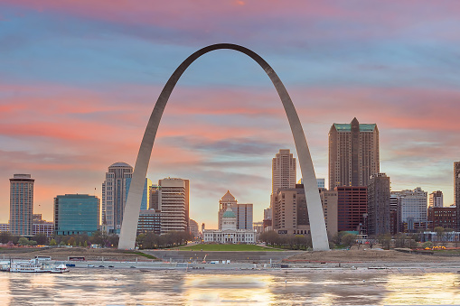 Downtown St. Louis city skyline with The Gateway Arch, cityscape of Missouri in USA at sunset