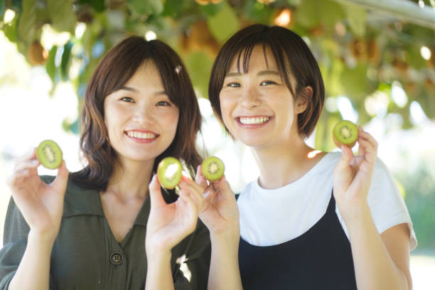 istock Woman with kiwi 1352972764