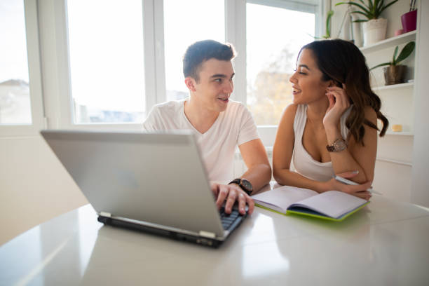 istock Cuple researching internet on laptop from home 1352973453