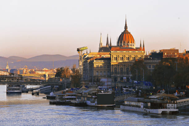 istock Hungarian parliament at sunrise on Danube River, Budapest, Hungary 1352975978