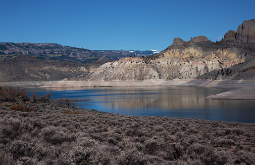 This reservoir, the largest in Colorado, resulted from damming the Gunnison River.  It is part of the Curecanti National Recreational Area.  Currently, its water level is at a record low due to diversion downstream to Lake Powell and, ultimately, Glen Canyon Dam, which supplies electricity to millions of people.