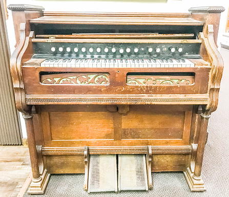 Antique piano keys have parlayed many notes in their days. They have stood the test of time. With over 100 years of service, this antique organ is a reminder of days gone by.