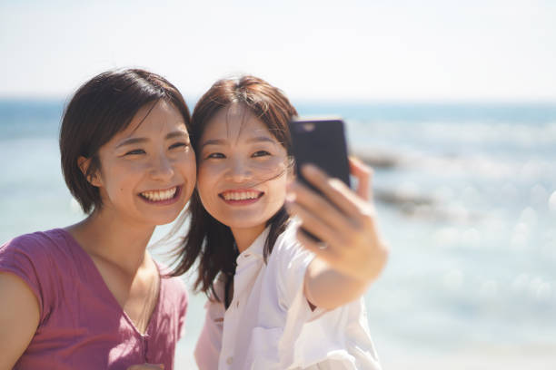 istock Female taking pictures with a smartphone 1352984571