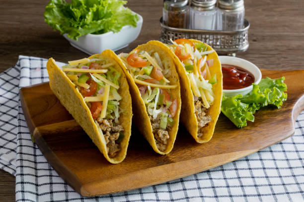 istock tacos with meat and vegetables, Mexican food 1352984687
