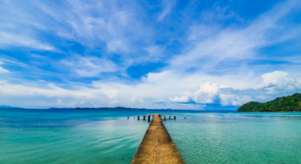 istock Bridge and Pier in Thai Andaman Sea with Clouds 1352985264