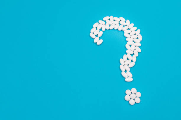 istock White Question Mark. Pharmaceutical Industry and Medicinal Products 1352987691