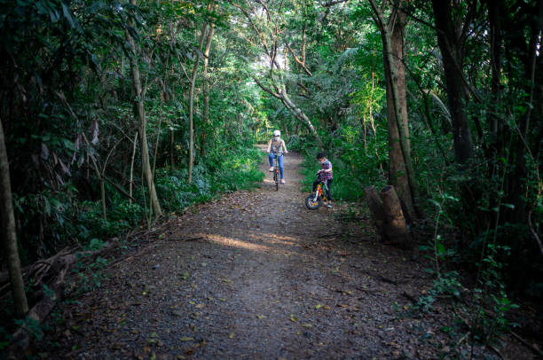 Mom and son enjoying life in the woodland