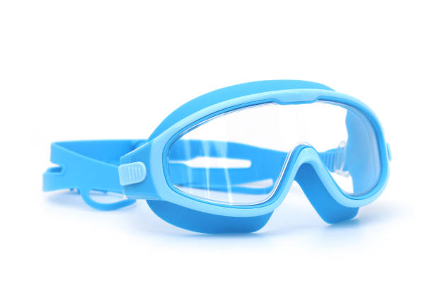 Green and blue swimming (pool) glasses on white ground