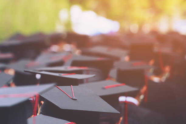 istock Image blur education group of graduates during commencement. Concept education congratulation in University Degree. Graduation Ceremony 1352995305