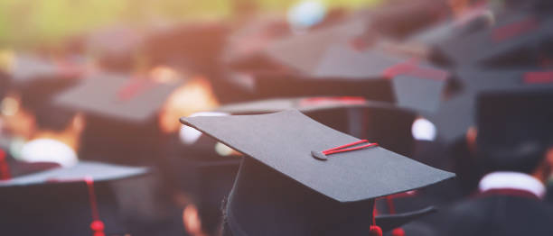 istock Image blur education group of graduates during commencement. Concept education congratulation in University Degree. Graduation Ceremony 1352995313