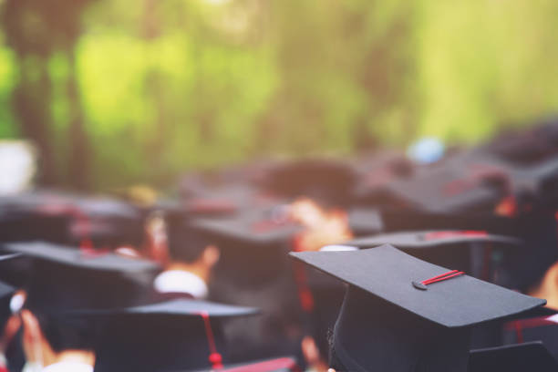 istock Image blur education group of graduates during commencement. Concept education congratulation in University Degree. Graduation Ceremony 1352995317