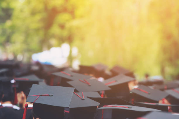 istock Image blur education group of graduates during commencement. Concept education congratulation in University Degree. Graduation Ceremony 1352995340