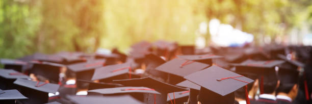 istock Image blur education group of graduates during commencement. Concept education congratulation in University Degree. Graduation Ceremony 1352995344
