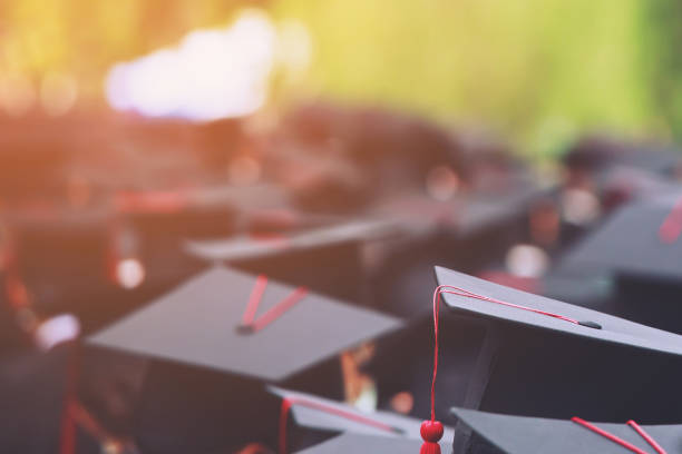 istock Blur,group of Graduates during commencement stand in row. Concept education congratulation in University. Graduation Ceremony. copy space banner 1352996321
