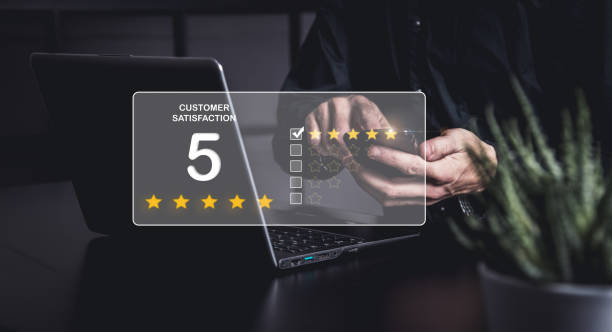 istock Business men is typing a costumer satisfaction on his smartphone 1352999266