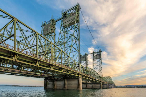 istock Long sectional arched transportation Interstate Columbia River Lift Bridge against cloudy sky 1353000901