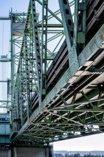 istock Riveted frame of a powerful sectional arched lifting transport bridge on concrete supports over the Columbia River in the West of America 1353000946
