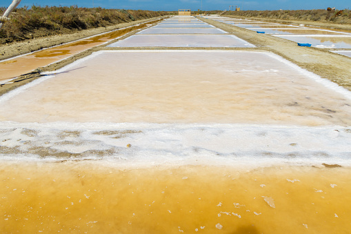 Saline artisans to obtain salt by the traditional method in Chiclana de la Frontera, Cadiz, Spain