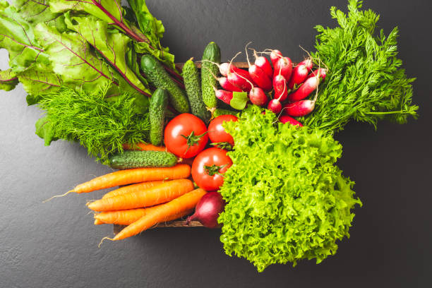 istock Mix of vegetables on black background. Close up 1353010053