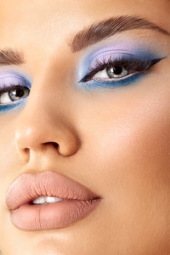 close up beauty portrait with blue eyes and chubby sexy lips