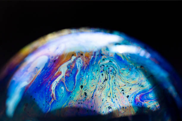 istock Abstract pattern, multicolored chaotic texture inside of the soap bubble, closeup 1353014990