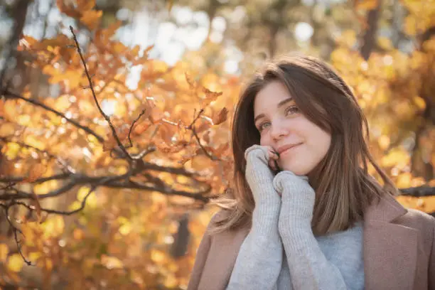 Portrait of a thoughtful and sad girl. Autumn colors . Lifestyle. Autumn mood. Forest