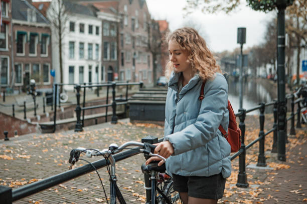 istock Beautiful female university student on campus 1353015686