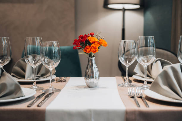 istock Elegant table set in modern style dining room interior 1353016785
