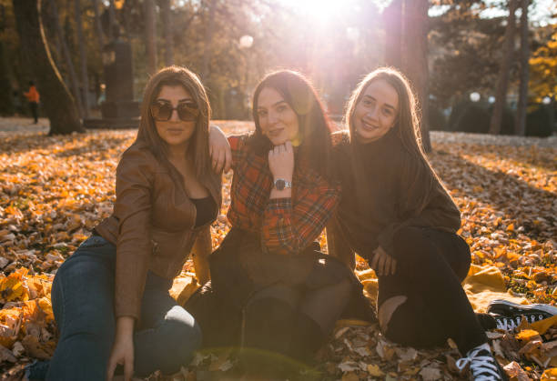 istock Three beautiful young women illuminated by the sun 1353017051