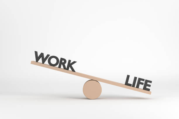 istock words work and life on wooden seesaw unbalancing on white background 1353018435
