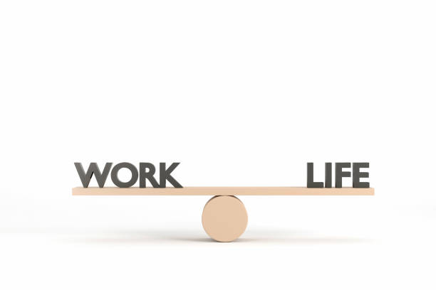 istock words work and life on wooden seesaw balancing on white background 1353018504