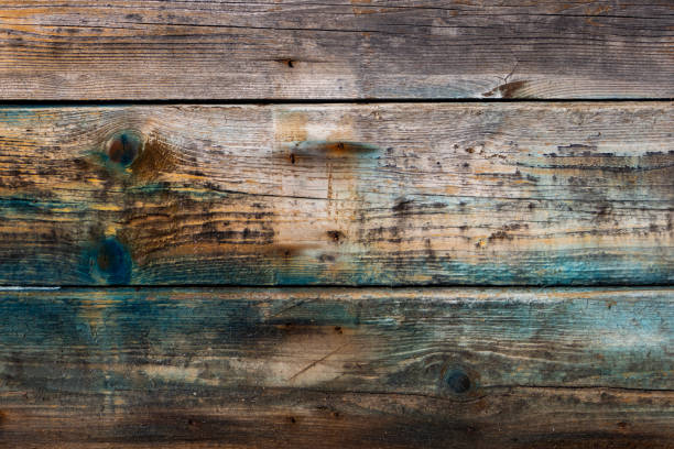 istock Old grungy wooden plank background wit old blue smeared paint 1353019335