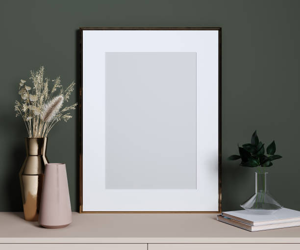 istock Stylish decorative set with golden frame for mockup, green wall, pink shelf and plants, 3d rendering 1353020455