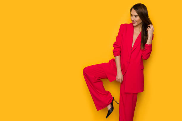 beautiful young woman is posing in oversize red costume. - fato de senhora imagens e fotografias de stock