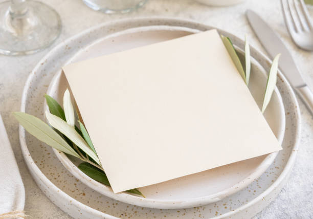 istock Wedding Table place with a card decorated with olive branches 1353024563