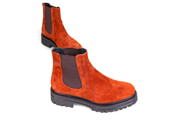 istock pair of brown boots on the white 1353026476
