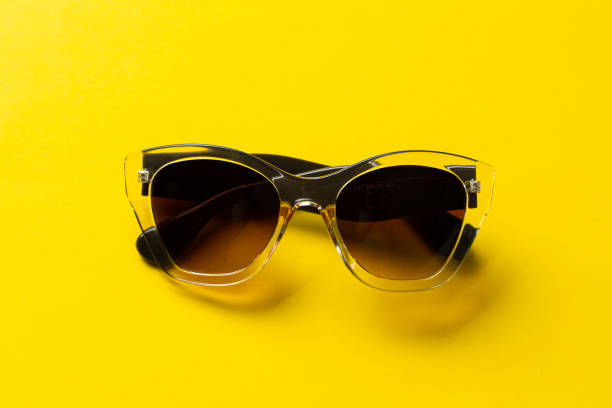 istock Sunglasses on a yellow background. UV protection 1353026522